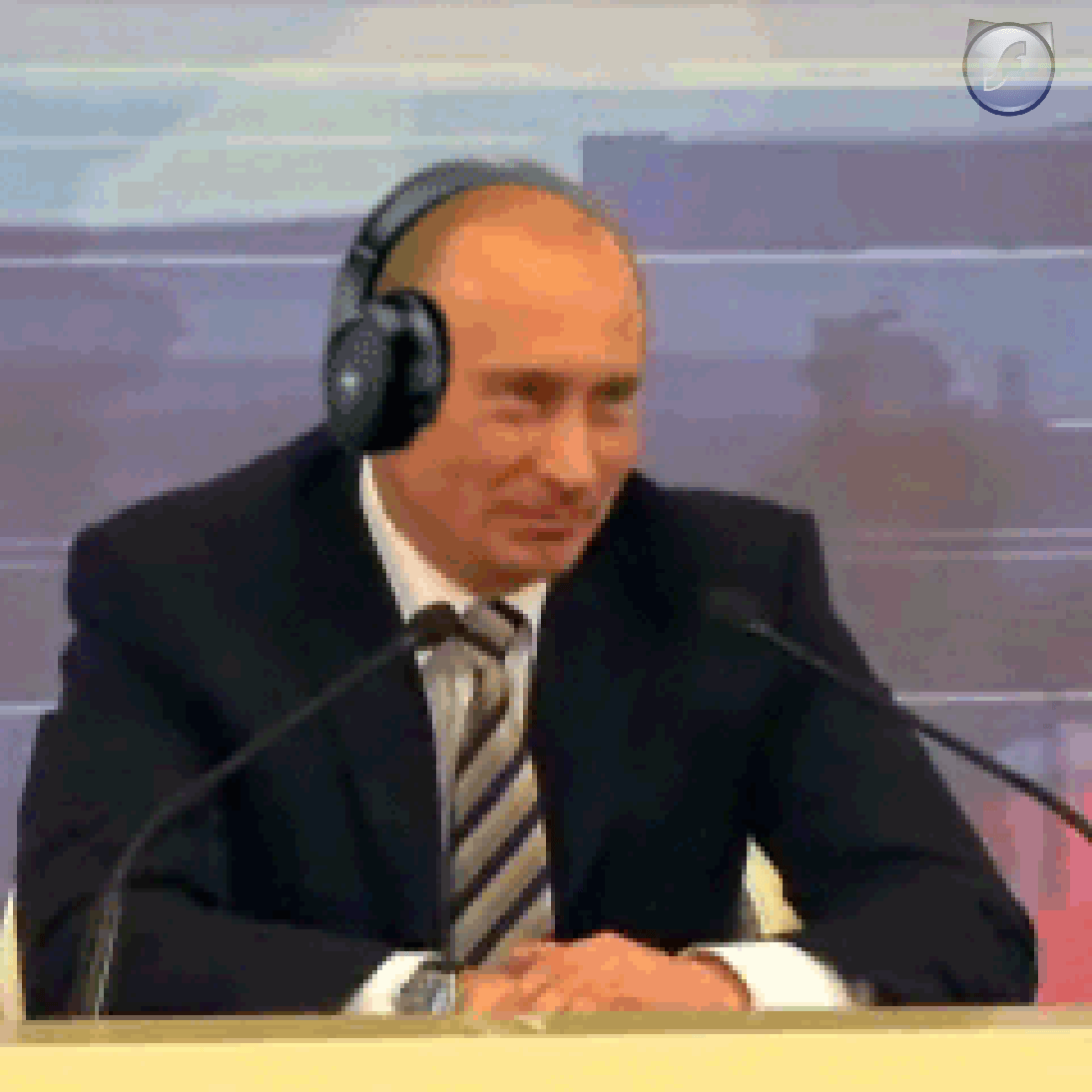Putin wearing headphones